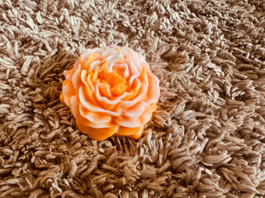 Orange and white swirl peony candle