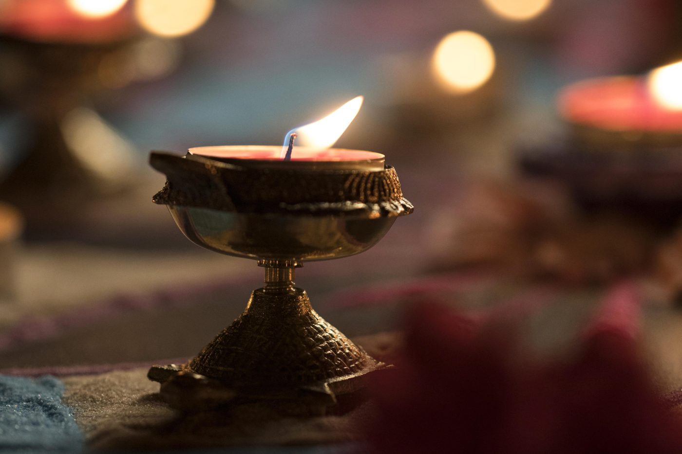 Brass diya glowing for Diwali